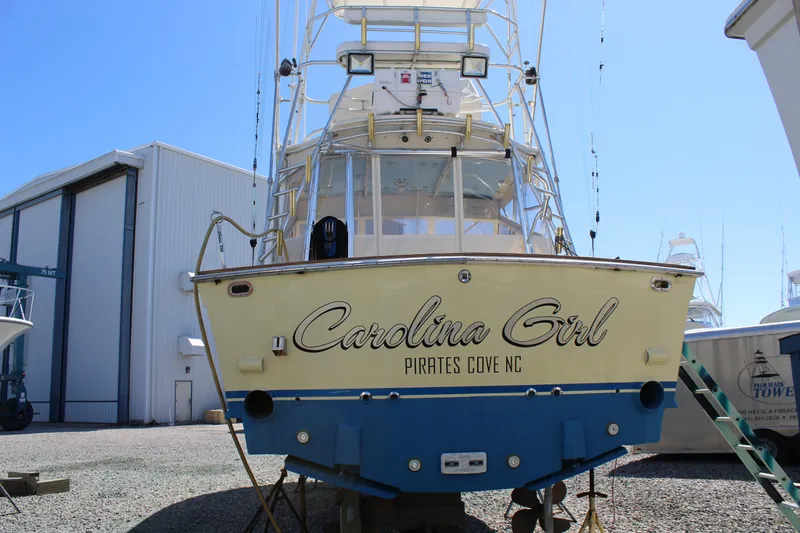 Slide: The Image of 1985 Viking Express boat "Carolina Girl" at Pirates Cove, NC, in a marina. - 8