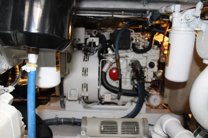 Slide: The Image of Engine room of 1985 Viking Express boat with visible machinery and components. - 24