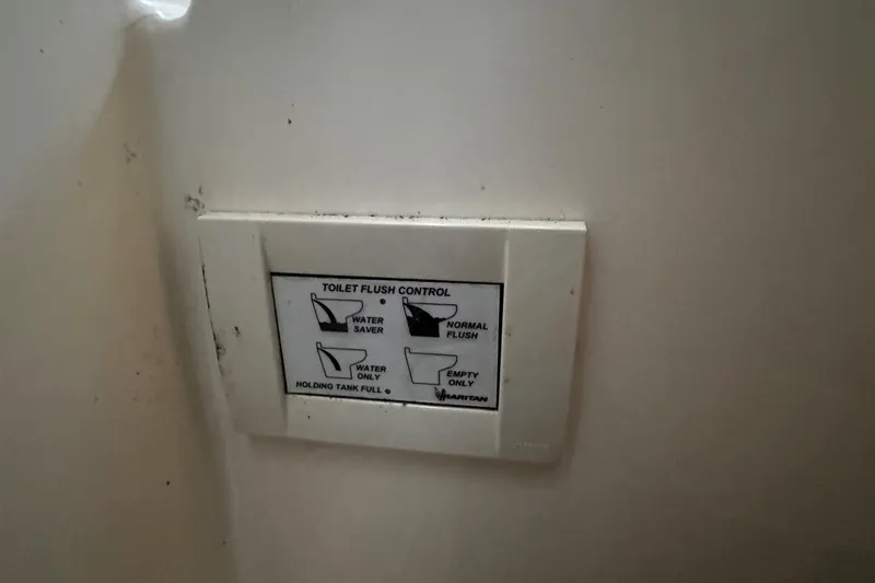 Slide: The Image of 1980 Bertram 33 Sport Fisherman toilet flush control panel - 14