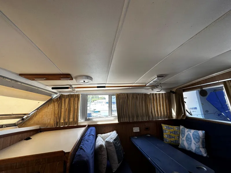 Slide: The Image of Interior of 1980 Bertram 33 Sport Fisherman with seating and windows. - 11