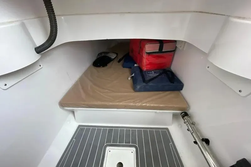 Slide: The Image of 2018 Southport 33 FE cabin interior with storage and equipment. - 25