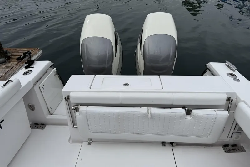 Slide: The Image of 2018 Southport 33 FE boat with dual outboard engines at dock. - 8