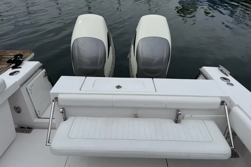 Slide: The Image of 2018 Southport 33 FE boat with dual outboard engines and white seating. - 9