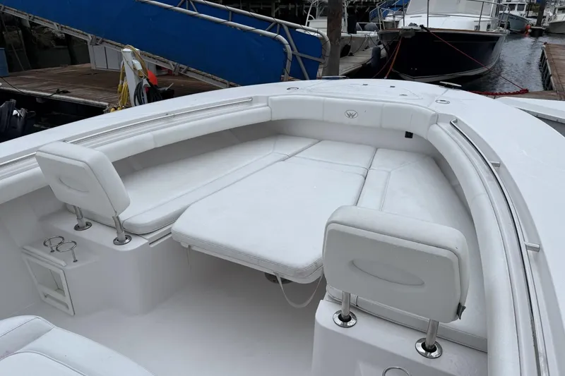 Slide: The Image of 2018 Southport 33 FE boat with spacious white seating area at the bow. - 19