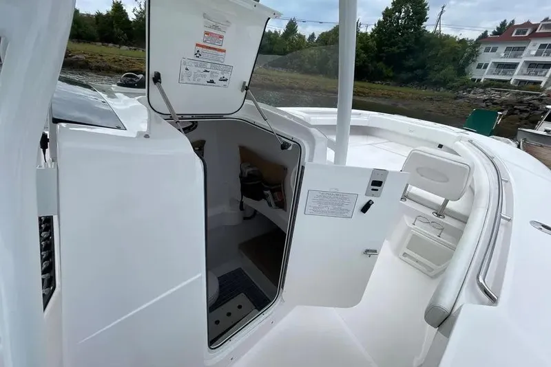 Slide: The Image of 2018 Southport 33 FE boat interior with open hatch and seating area. - 23