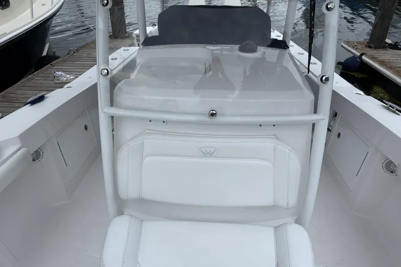 Slide: The Image of 2018 Southport 33 FE boat interior with white seating and console. - 20