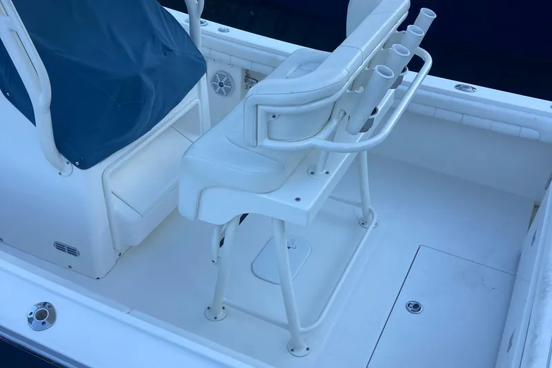 Slide: The Image of 2017 Regulator 23 Forward Seating boat interior with white seating and rod holders. - 20