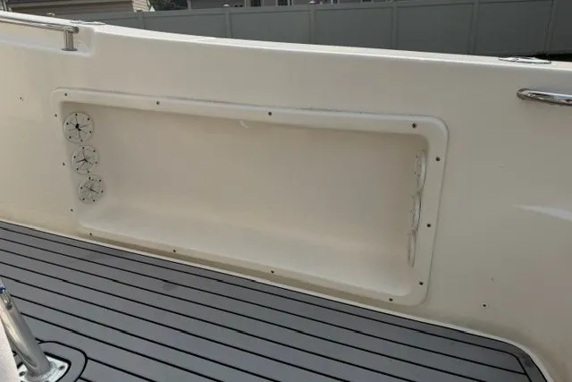 Slide: The Image of 2021 Bulls Bay 230 Center Console boat interior with storage compartment and deck view. - 15