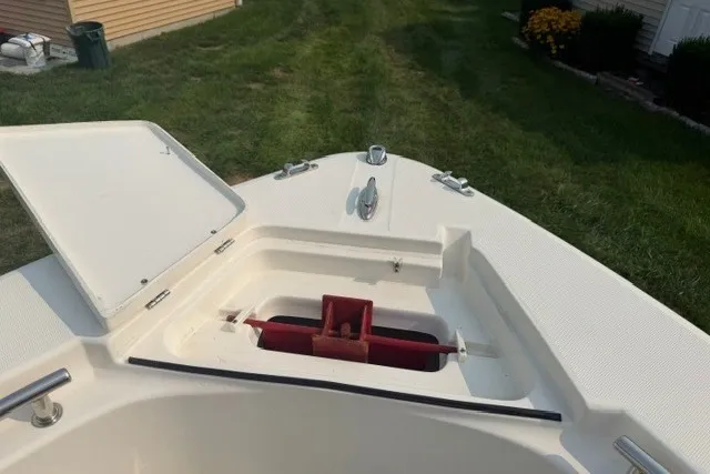 Slide: The Image of 2021 Bulls Bay 230 Center Console boat bow with open storage compartment. - 22
