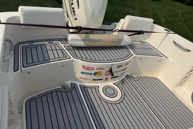 Slide: The Image of 2021 Bulls Bay 230 Center Console boat deck with Suzuki engine and custom flooring. - 18