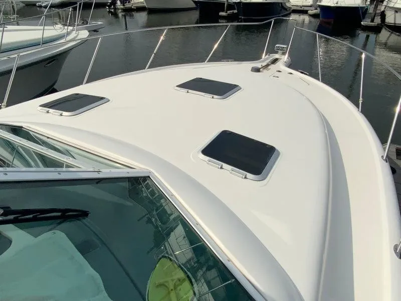 Slide: The Image of 2002 Tiara Yachts 3500 Open on water, front deck view. - 35