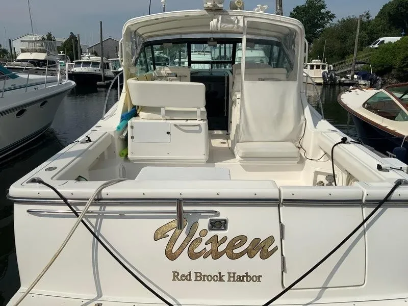 Slide: The Image of 2002 Tiara Yachts 3500 Open at harbor, rear view of boat. - 33