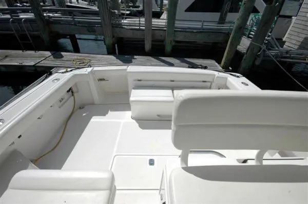 Slide: The Image of Interior of a 2002 Tiara Yachts 3500 Open, featuring white seating area. - 4