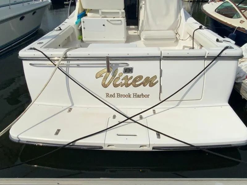 Slide: The Image of Rear view of 2002 Tiara Yachts 3500 Open at harbor. - 34