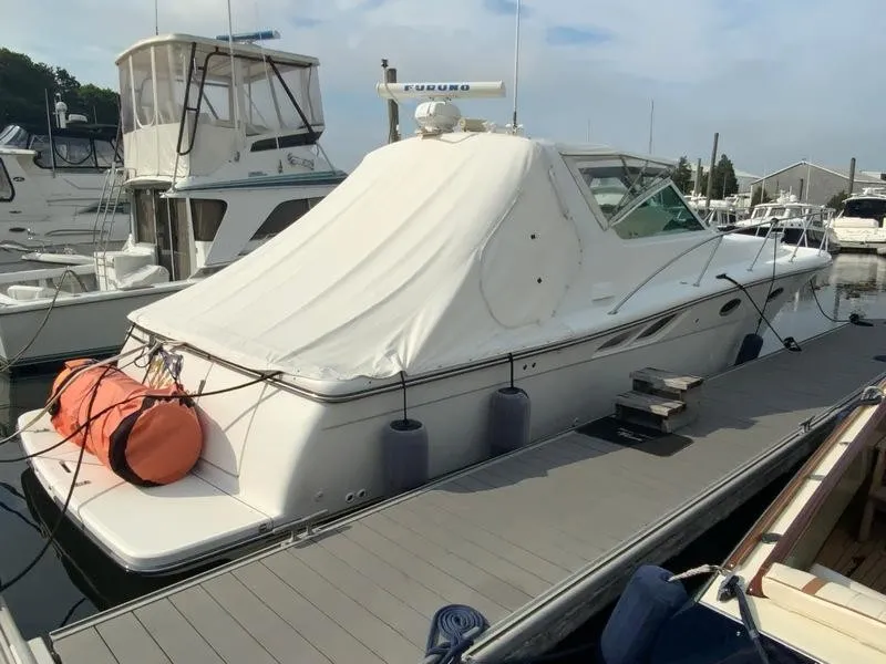 Slide: The Image of 2002 Tiara Yachts 3500 Open at dock, covered. - 25