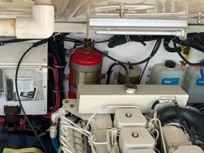 Slide: The Image of Engine room of 2002 Tiara Yachts 3500 Open with fire extinguisher. - 42