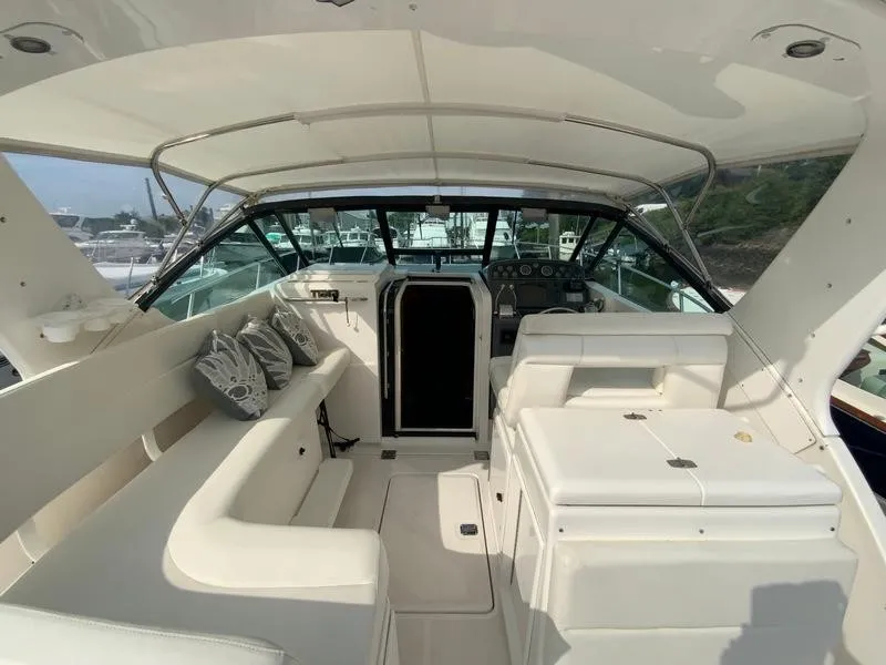 Slide: The Image of Interior of a 2002 Tiara Yachts 3500 Open, featuring seating and helm station. - 28