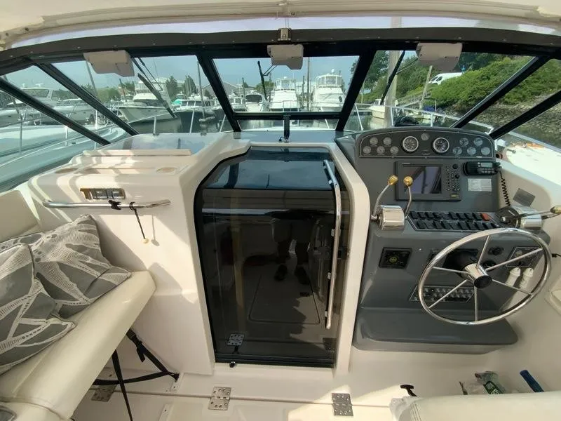 Slide: The Image of Interior of 2002 Tiara Yachts 3500 Open, helm and seating area. - 7