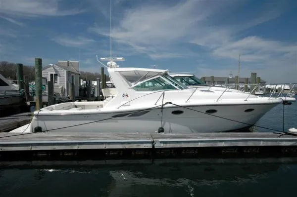 The Image of 2002 Tiara Yachts 3500 Open docked under sunny skies. - 1