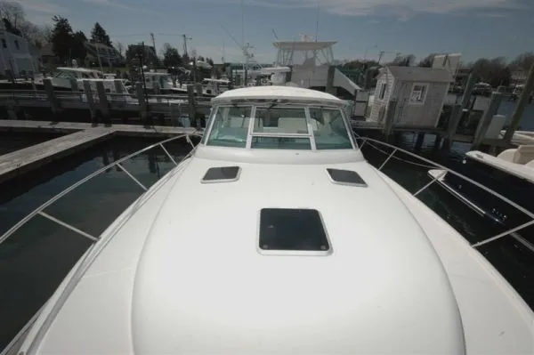 Slide: The Image of 2002 Tiara Yachts 3500 Open docked, front view. - 22