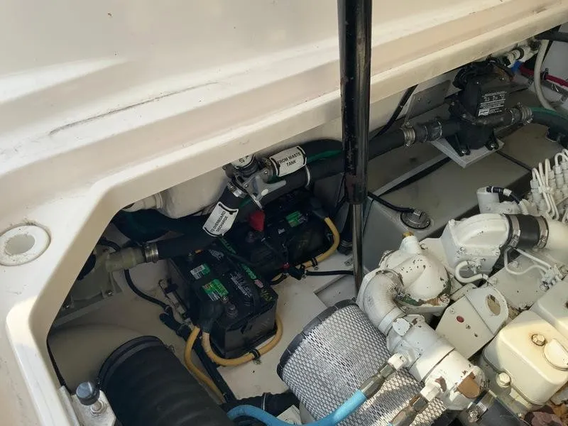 Slide: The Image of Engine compartment of 2002 Tiara Yachts 3500 Open with batteries and engine. - 48
