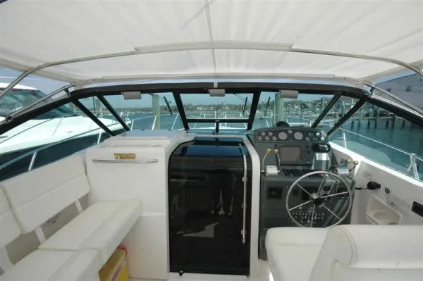 Slide: The Image of Interior of 2002 Tiara Yachts 3500 Open, helm and seating area. - 6