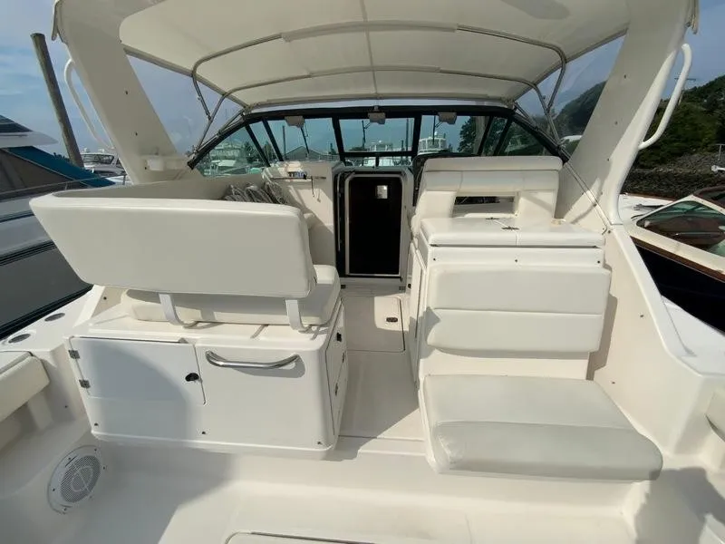 Slide: The Image of Interior of a 2002 Tiara Yachts 3500 Open with white seating. - 29