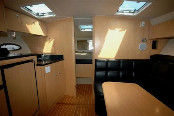 Slide: The Image of Interior of 2002 Tiara Yachts 3500 Open with wooden furnishings. - 10