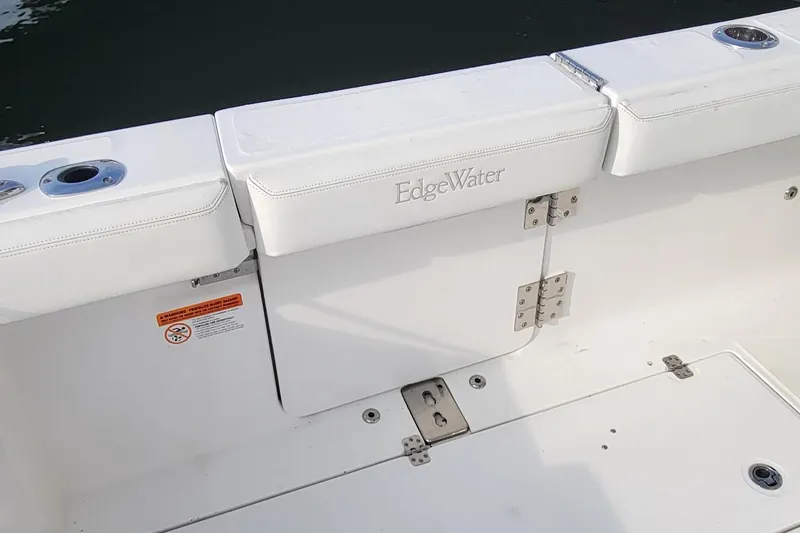 Slide: The Image of Edgewater 370CC 2018 boat interior with white seating and stainless steel fixtures. - 16