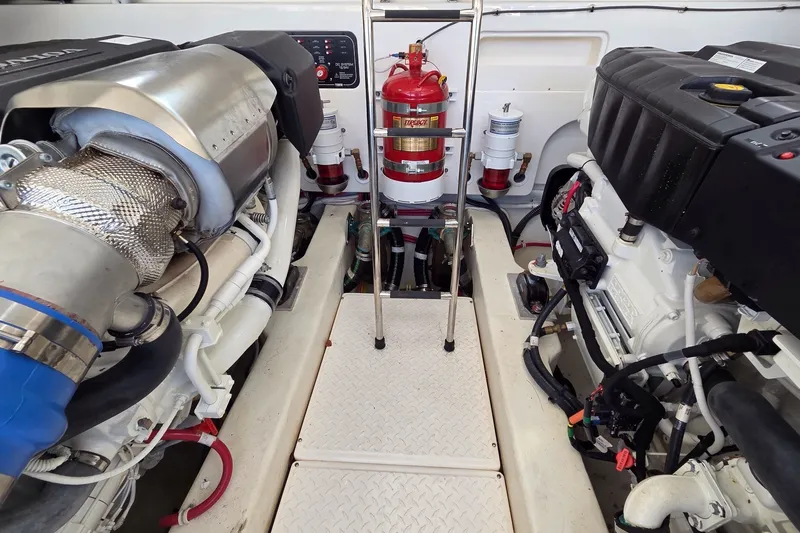Slide: The Image of Engine room of 2023 Tiara Yachts 4300 Open, featuring dual engines and fire extinguisher. - 31