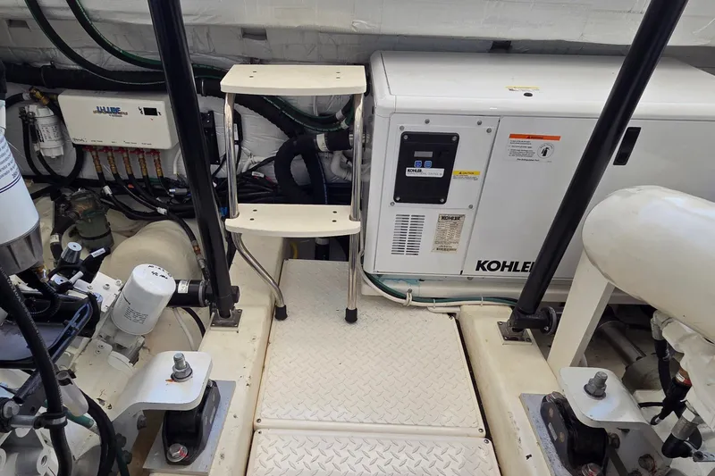 Slide: The Image of Engine room of 2023 Tiara Yachts 4300 Open with Kohler generator and equipment. - 34