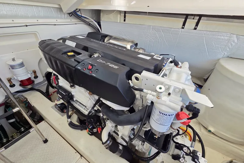Slide: The Image of Engine compartment of 2023 Tiara Yachts 4300 Open, featuring a Volvo marine engine. - 32