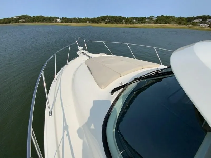 Slide: The Image of Tiara Yachts 36, 2013 model, cruising on calm waters with scenic shoreline view. - 28