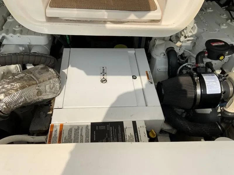 Slide: The Image of Engine compartment of a 2013 Tiara Yachts 36, showcasing mechanical components and systems. - 35