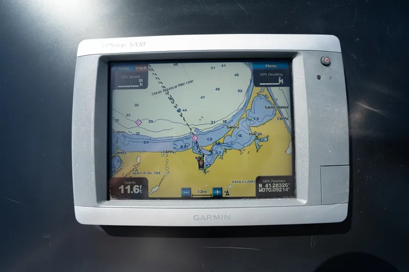 Slide: The Image of Garmin GPS display on 2011 Cabo 36 Express boat, showing nautical map and coordinates. - 21