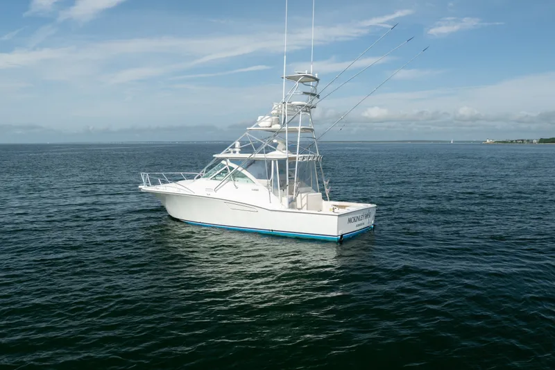 The Image of 2011 Cabo 36 Express boat on calm ocean waters under a clear sky. - 4