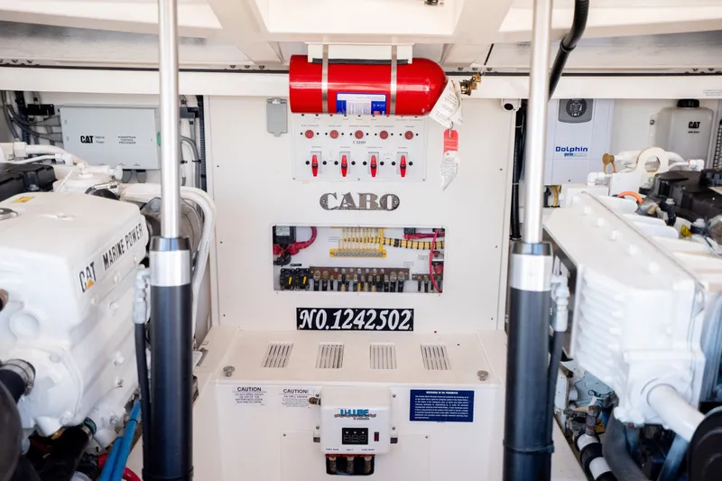 Slide: The Image of Engine room of a 2011 Cabo 36 Express boat, featuring CAT Marine Power engines. - 46