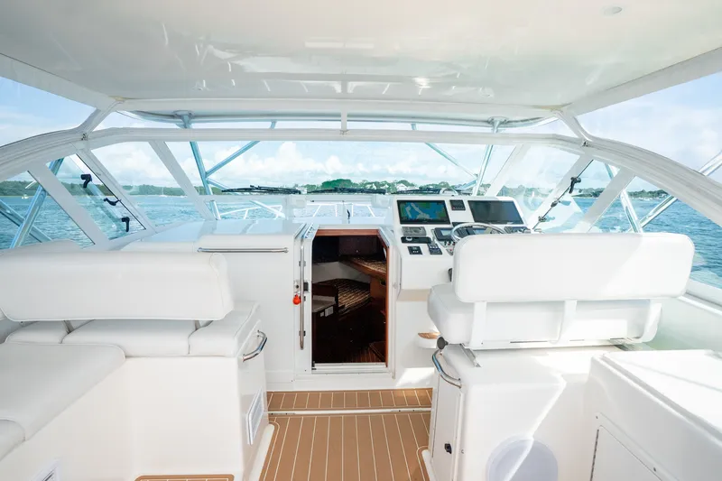 Slide: The Image of Interior view of 2011 Cabo 36 Express yacht cockpit with navigation equipment. - 30
