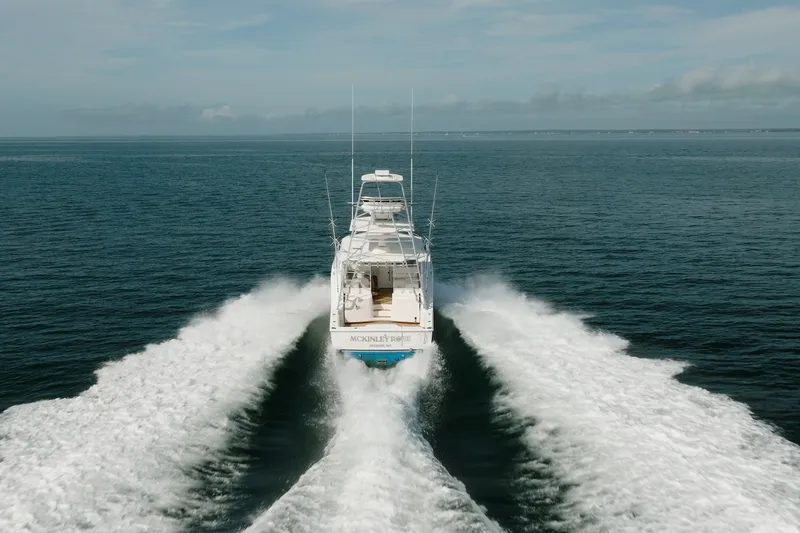 Slide: The Image of Cabo 36 Express 2011 yacht cruising on open sea, leaving a wake trail. - 2