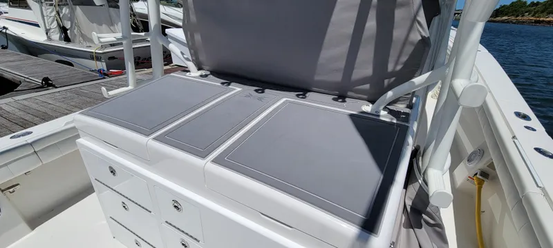 Slide: The Image of 2018 Regulator 41 Center Console boat seating and storage area. - 14