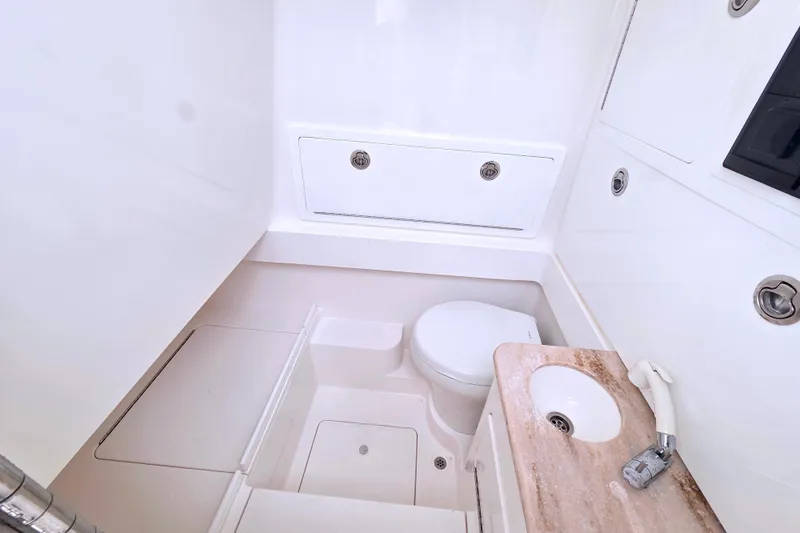Slide: The Image of 2021 Valhalla Boatworks V-33 interior bathroom with toilet and sink. - 17