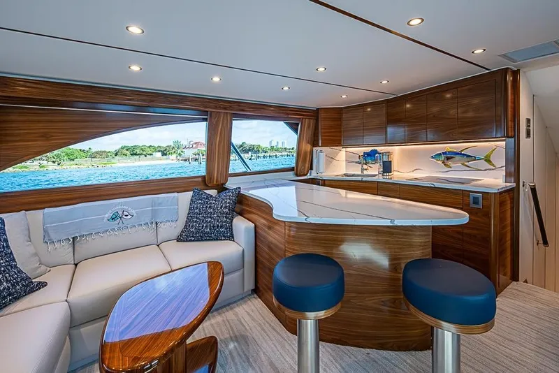 Slide: The Image of Luxurious interior of 2026 Viking 54 Convertible yacht with elegant wood finishes and modern design. - 33