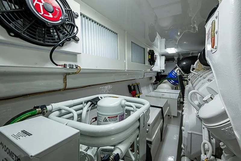 Slide: The Image of Engine room of 2026 Viking 54 Convertible yacht, showcasing advanced machinery and equipment. - 61