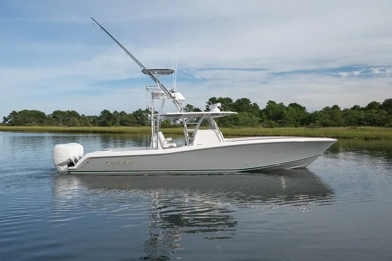 Slide: The Image of 2023 Invincible 39 Open Fisherman boat on calm water, side view. - 6