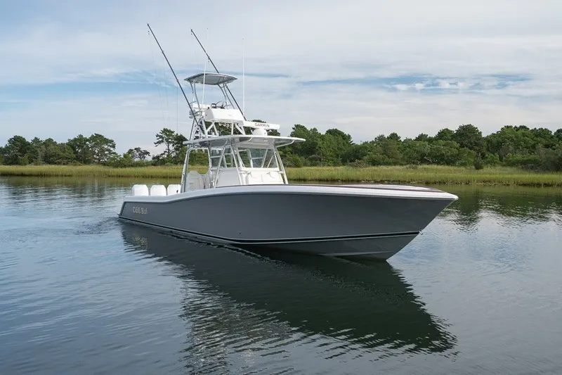 Slide: The Image of 2023 Invincible 39 Open Fisherman boat cruising on calm water. - 8