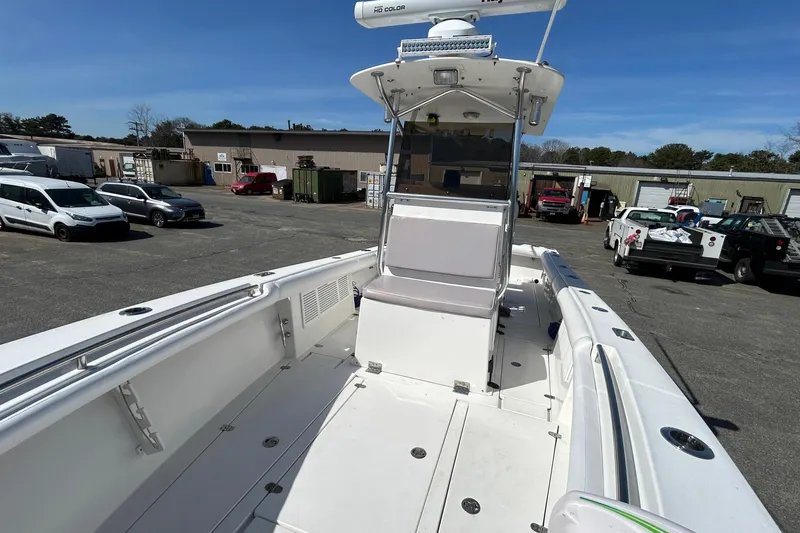 Slide: The Image of 2006 Albin 26 Center Console boat with Raymarine equipment, parked in a marina lot. - 23