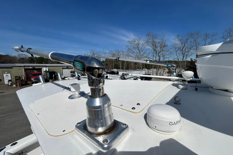 Slide: The Image of 2006 Albin 26 Center Console boat deck with fishing outriggers and Garmin equipment. - 28