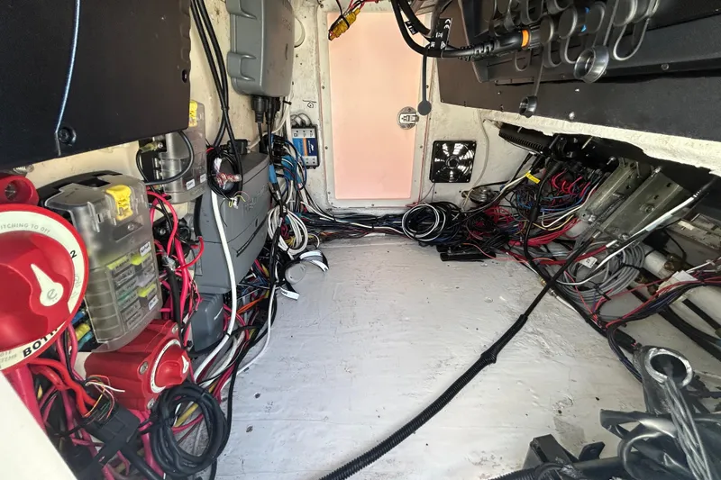 Slide: The Image of Interior wiring of a 2006 Albin 26 Center Console boat, showcasing electrical components. - 19
