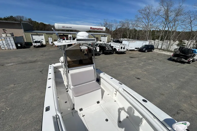 Slide: The Image of 2006 Albin 26 Center Console boat in a marina with Raymarine equipment. - 26