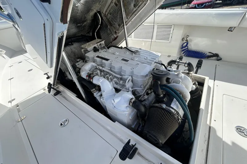 Slide: The Image of Engine compartment of a 2006 Albin 26 Center Console boat, showcasing detailed mechanics. - 41